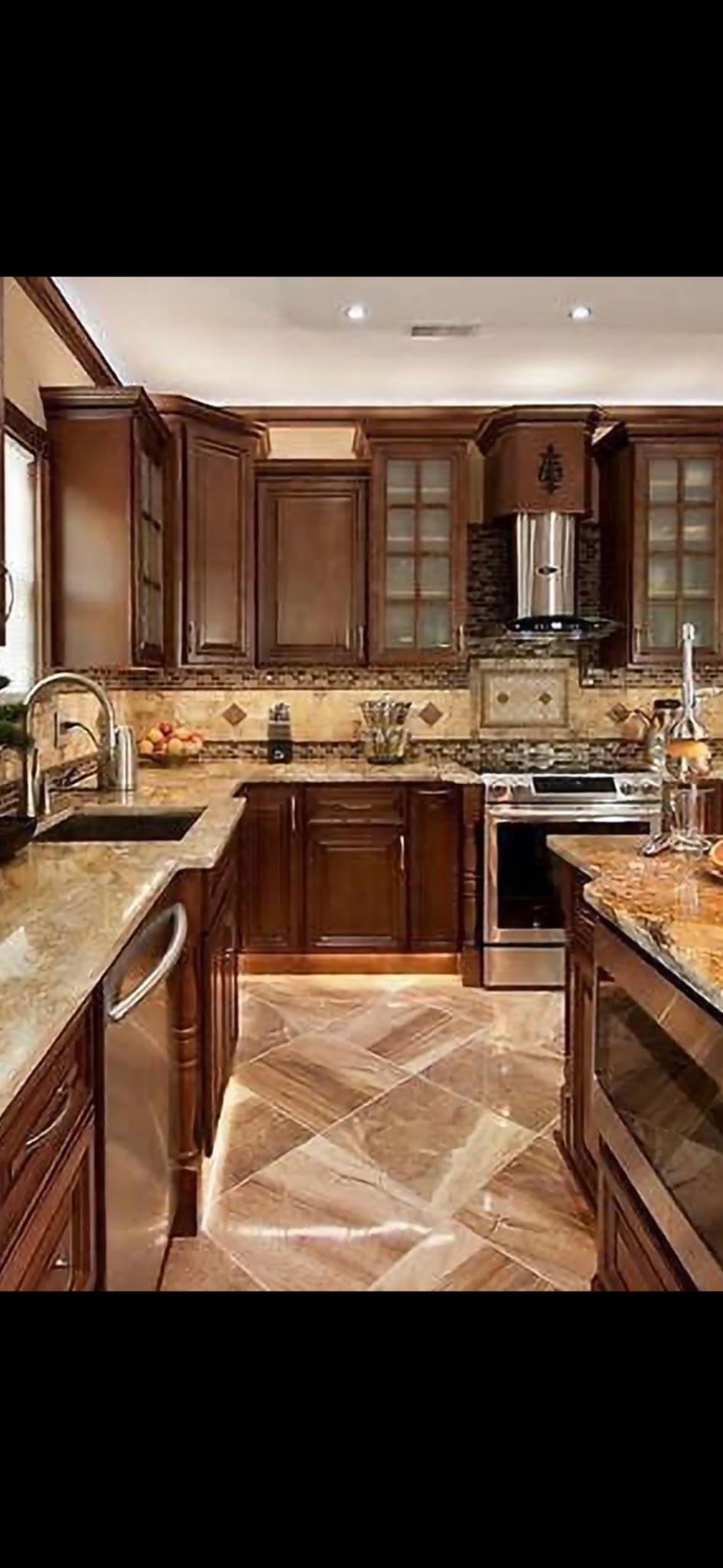 Dark cherry kitchen with professional grade appliances and large island