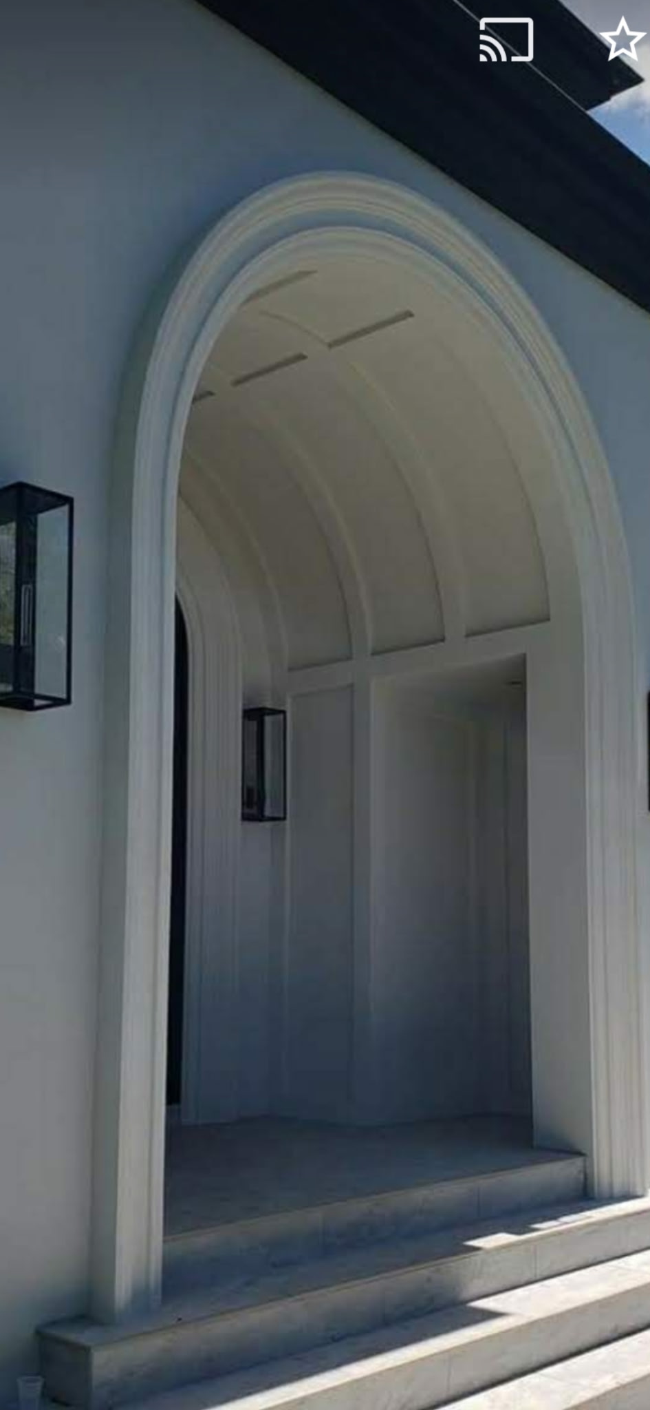 Gothic arch entrance exterior of custom home