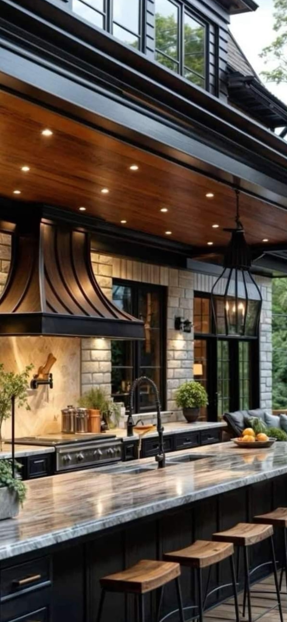 Custom outdoor kitchen with stone and wood finishes, Arizona desert landscaping